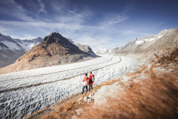 couple looking out over glacier