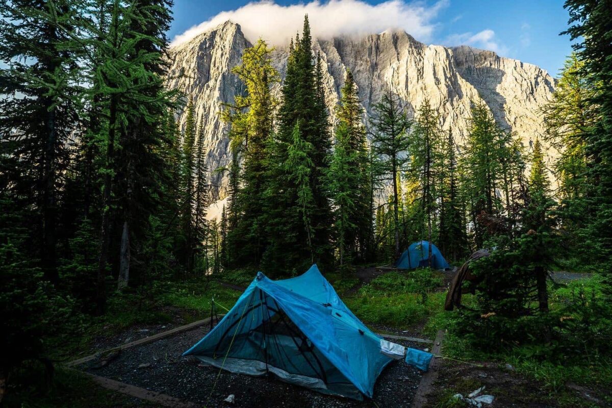 blue tent pitched near mountain