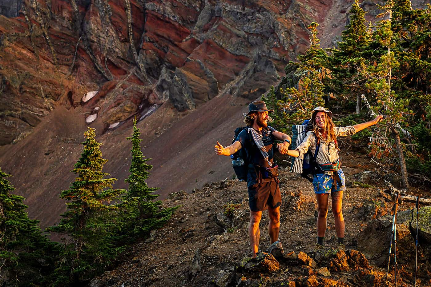 man and women looking happy near forest