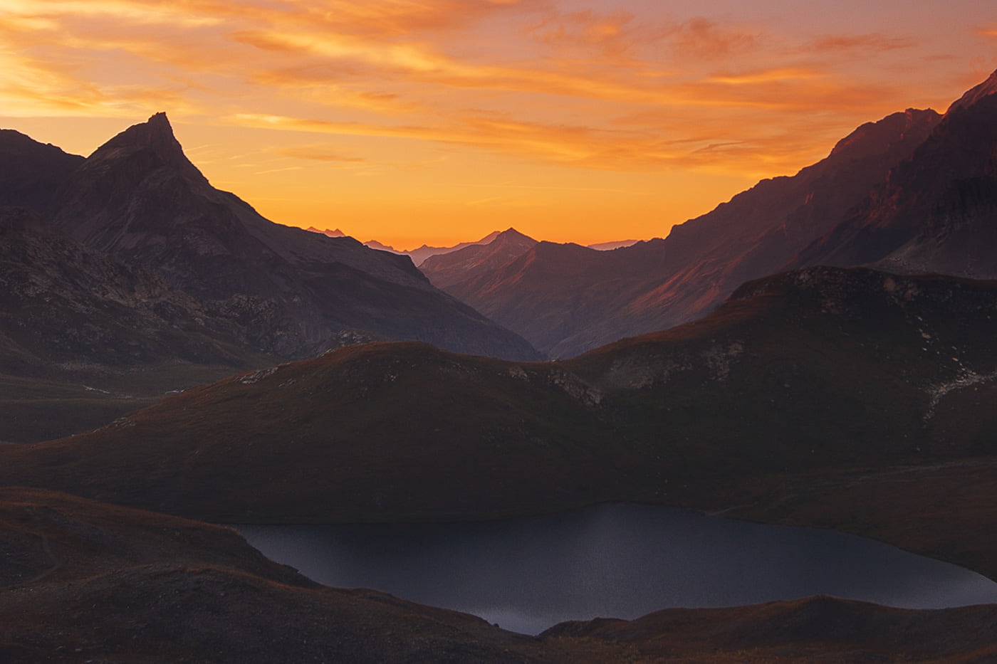 panoramic view of mountains in the alps during sunset