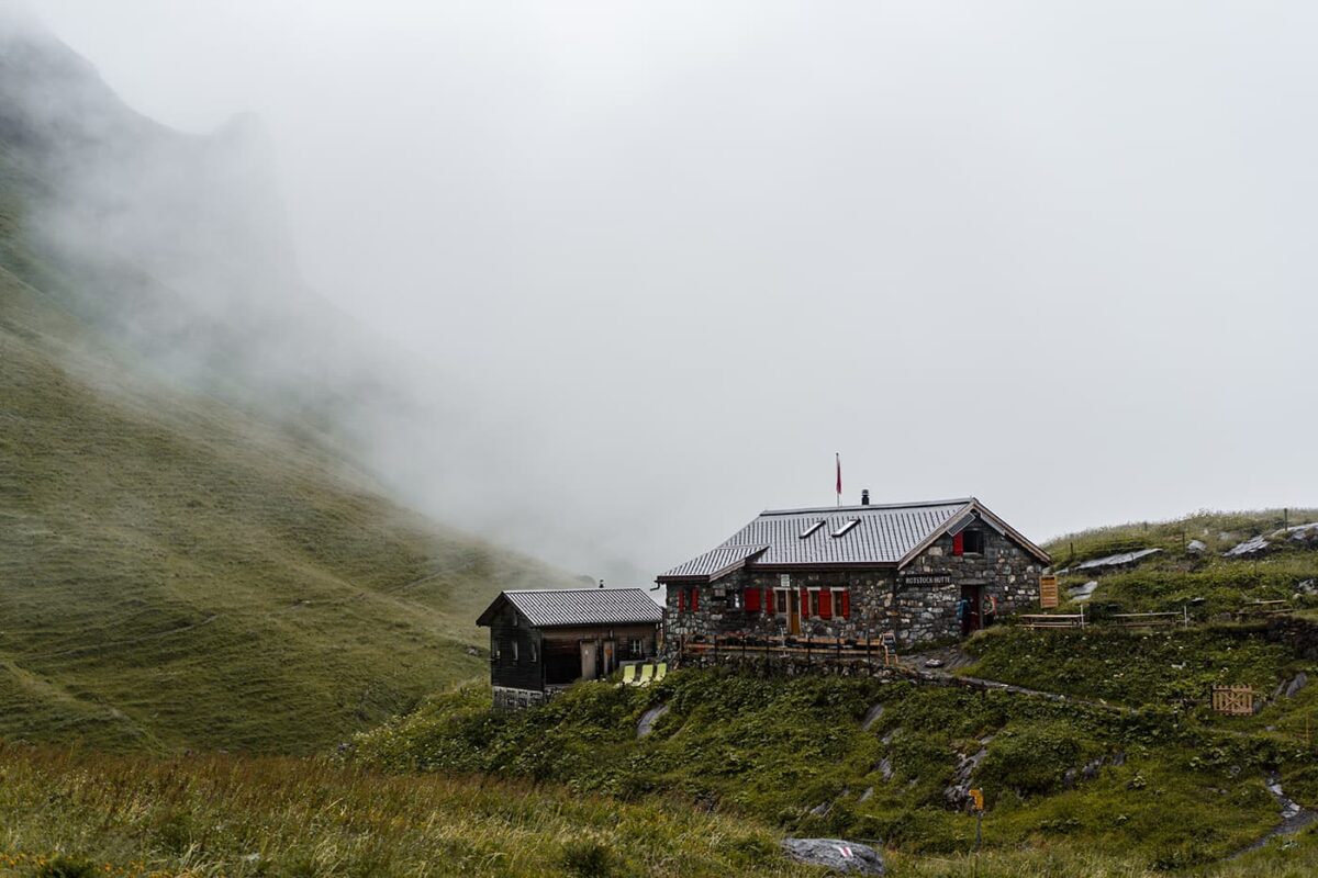 Stone Mountain hut on grassy landscape