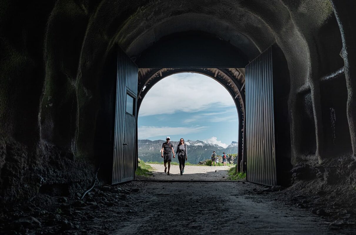 couple walking towards tunnel