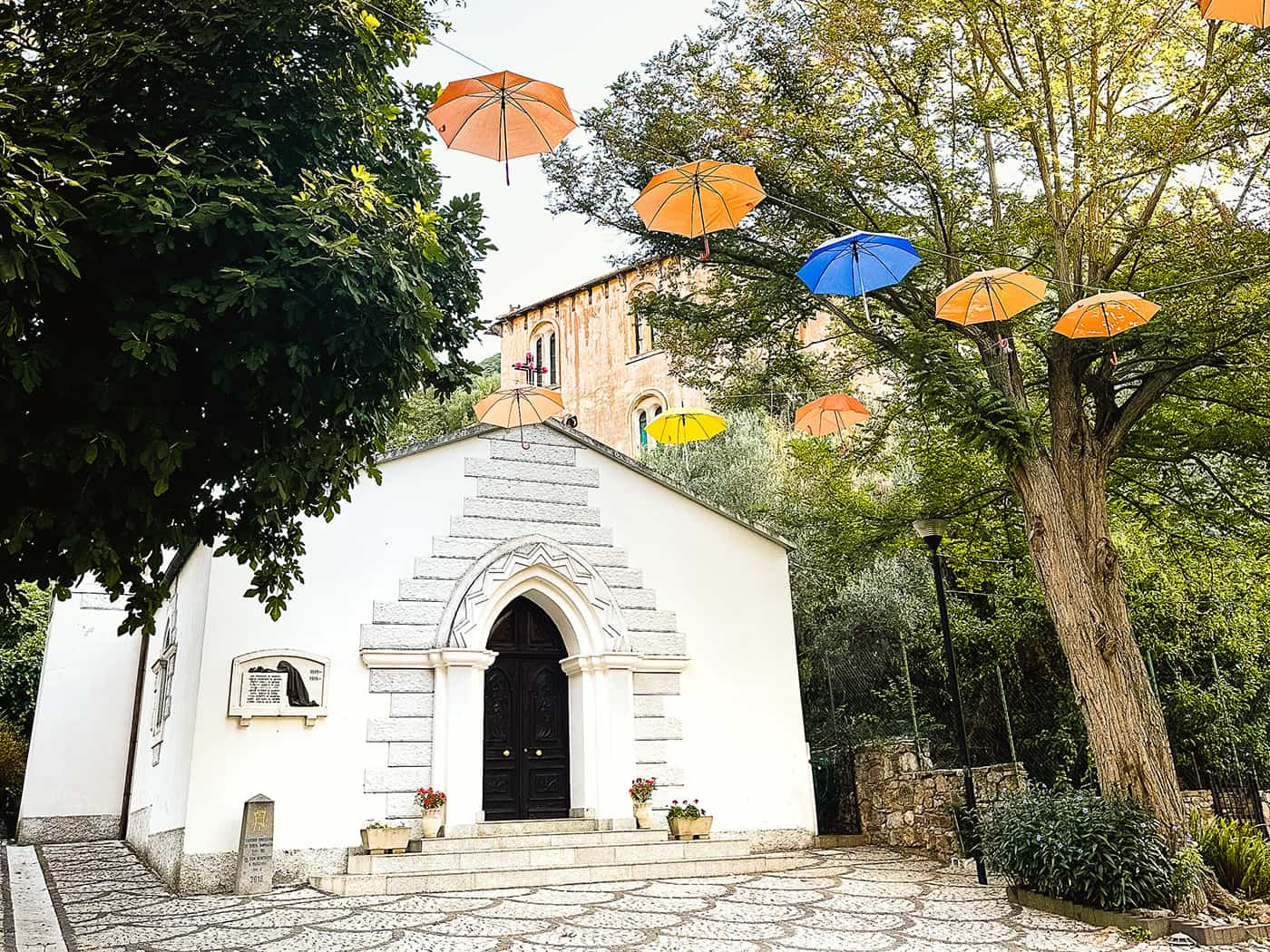 colorful umbrellas hanging above square