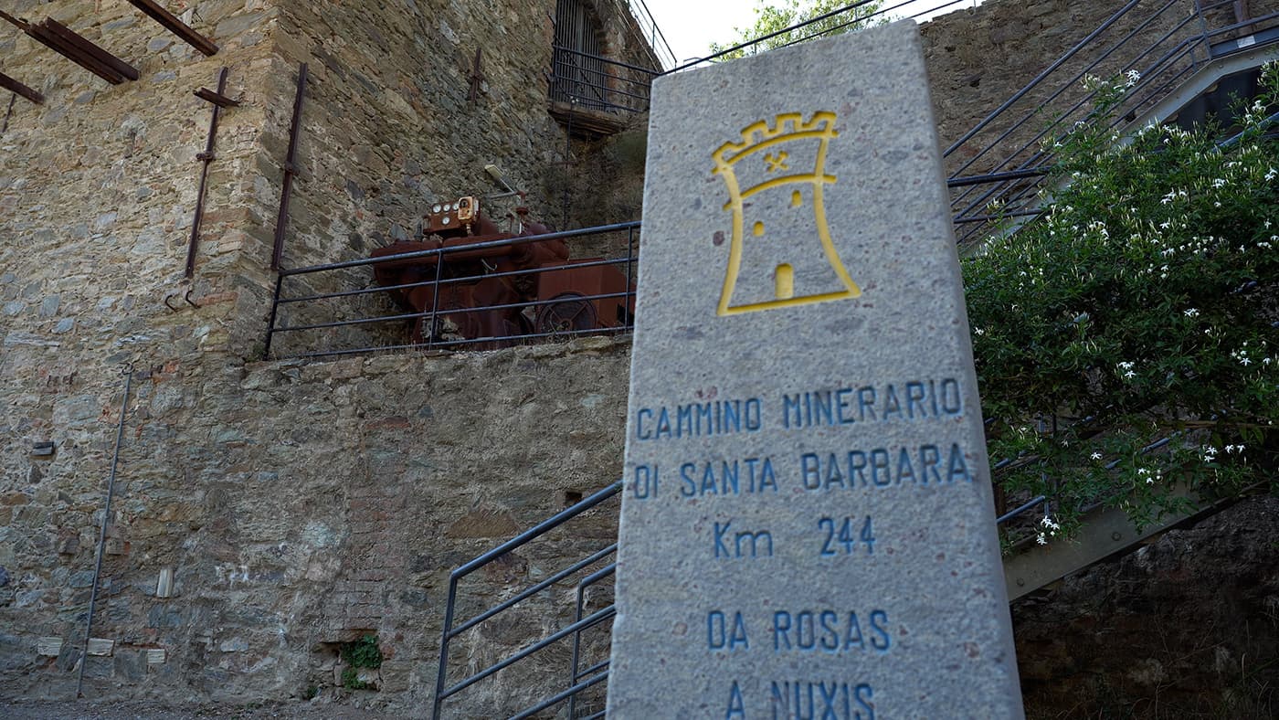 stone sign in front of house