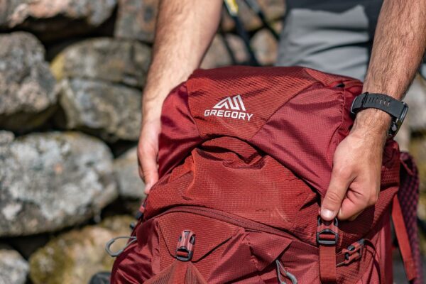 man holding his backpack