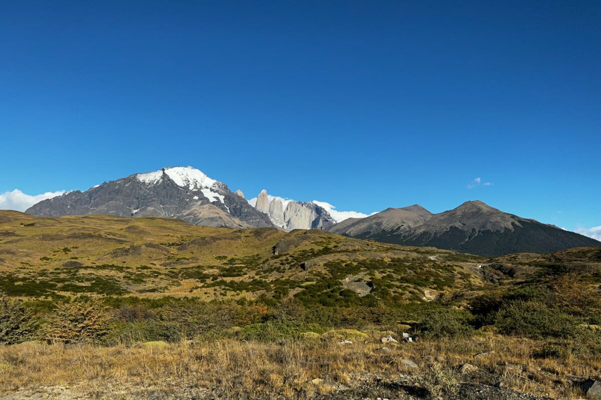 green landscape with mountains in background