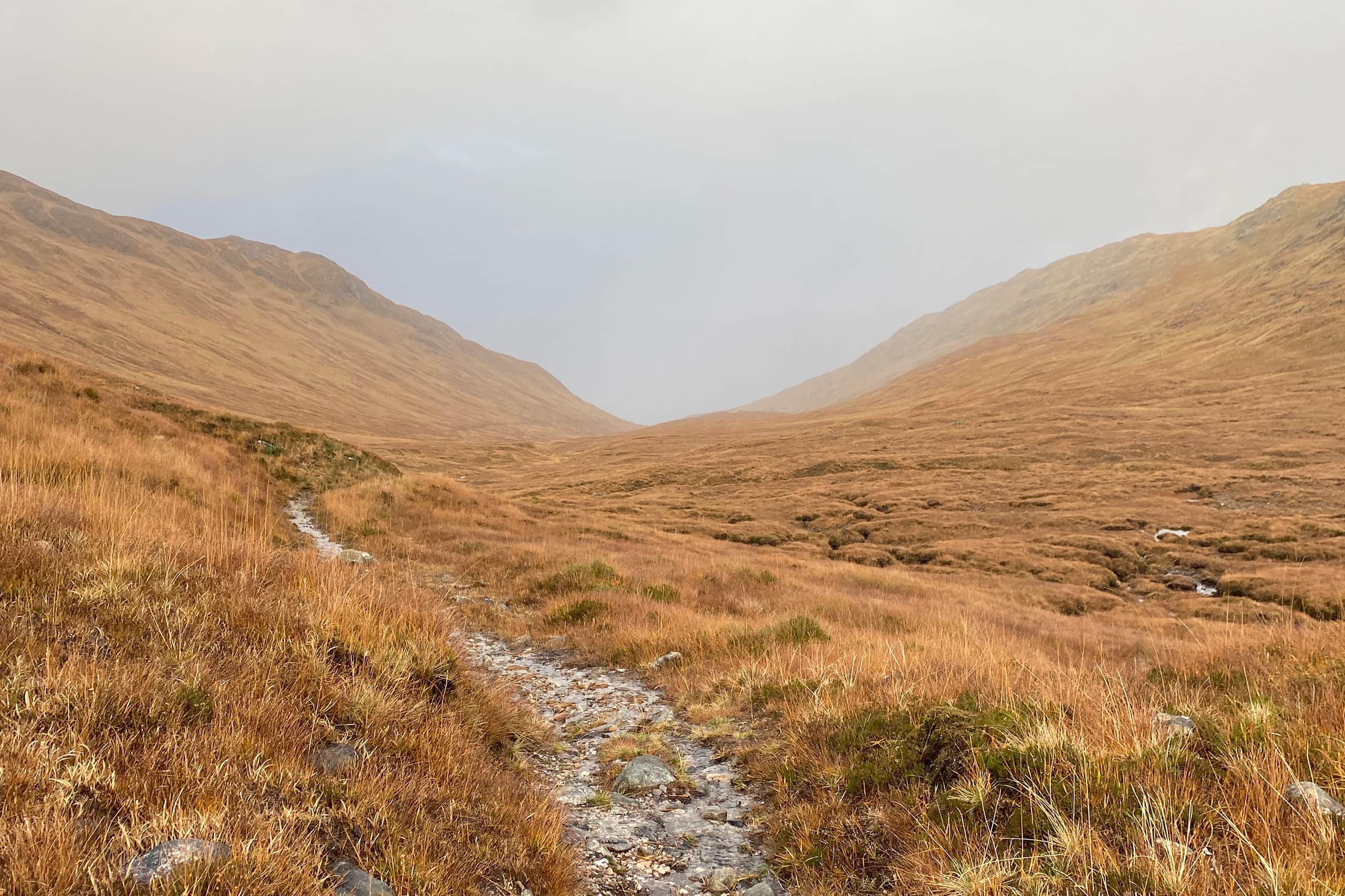 hiking trail in misty hills Scotland