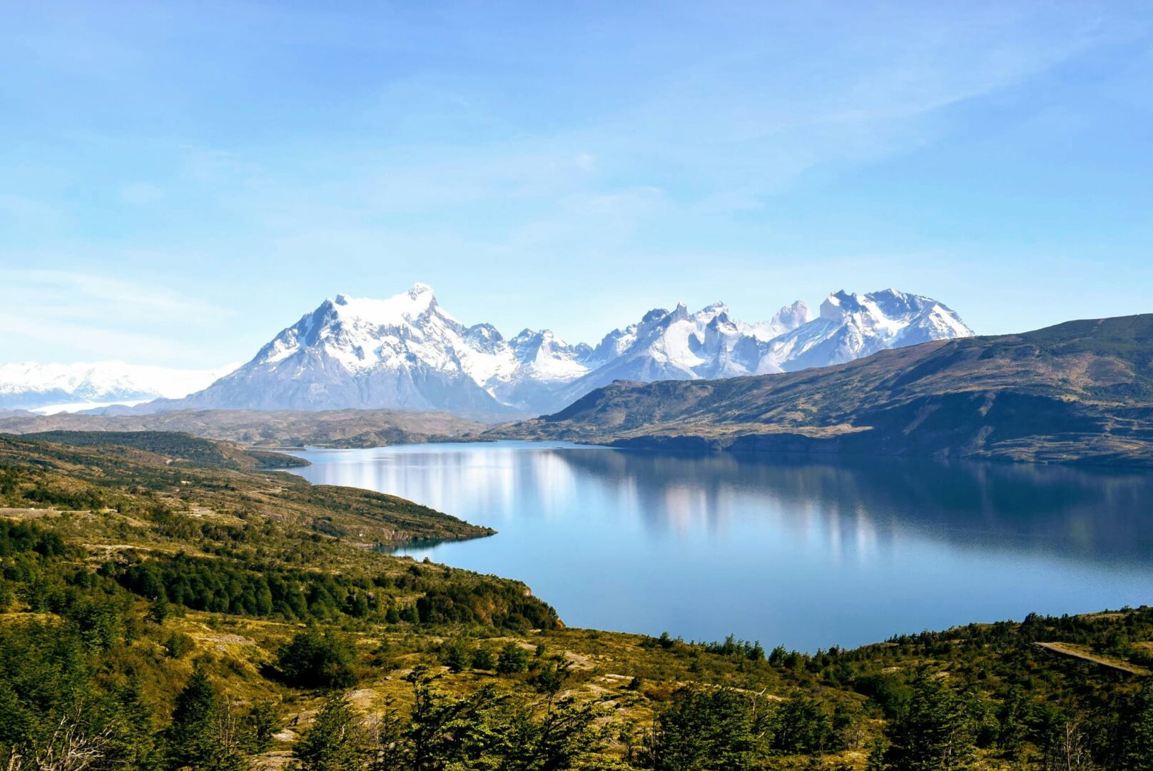 snow capped mountains and body of water