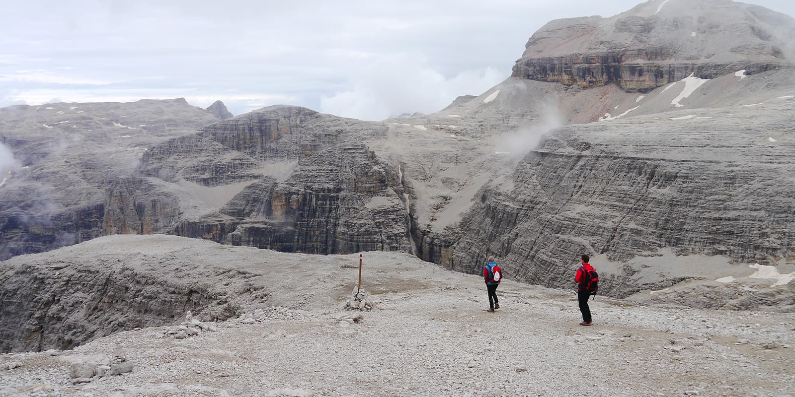 two people hiking on the Alta Via 2 in the dolomites