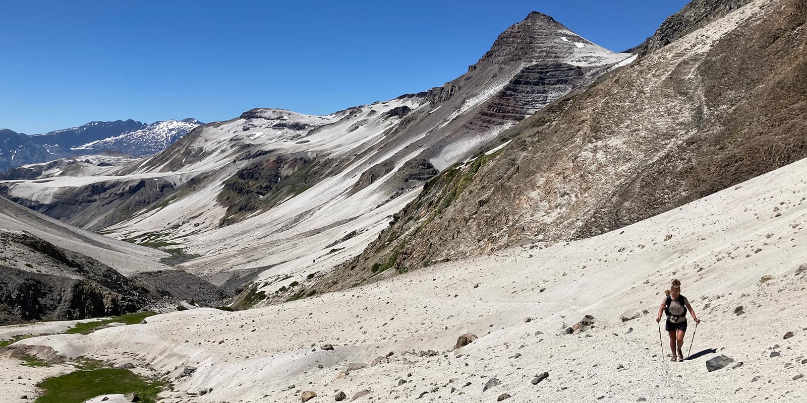 person hiking on mountain trail in Patagonia