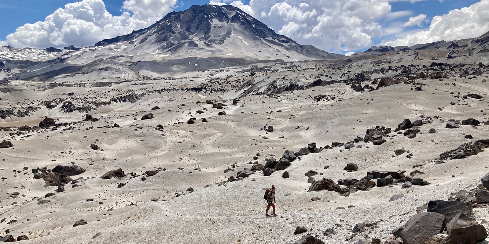 person hiking on mountain trail in Patagonia