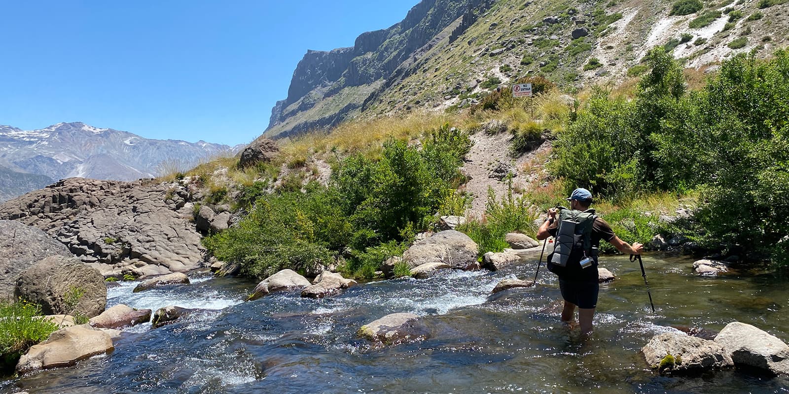 person crossing river in Patagonia