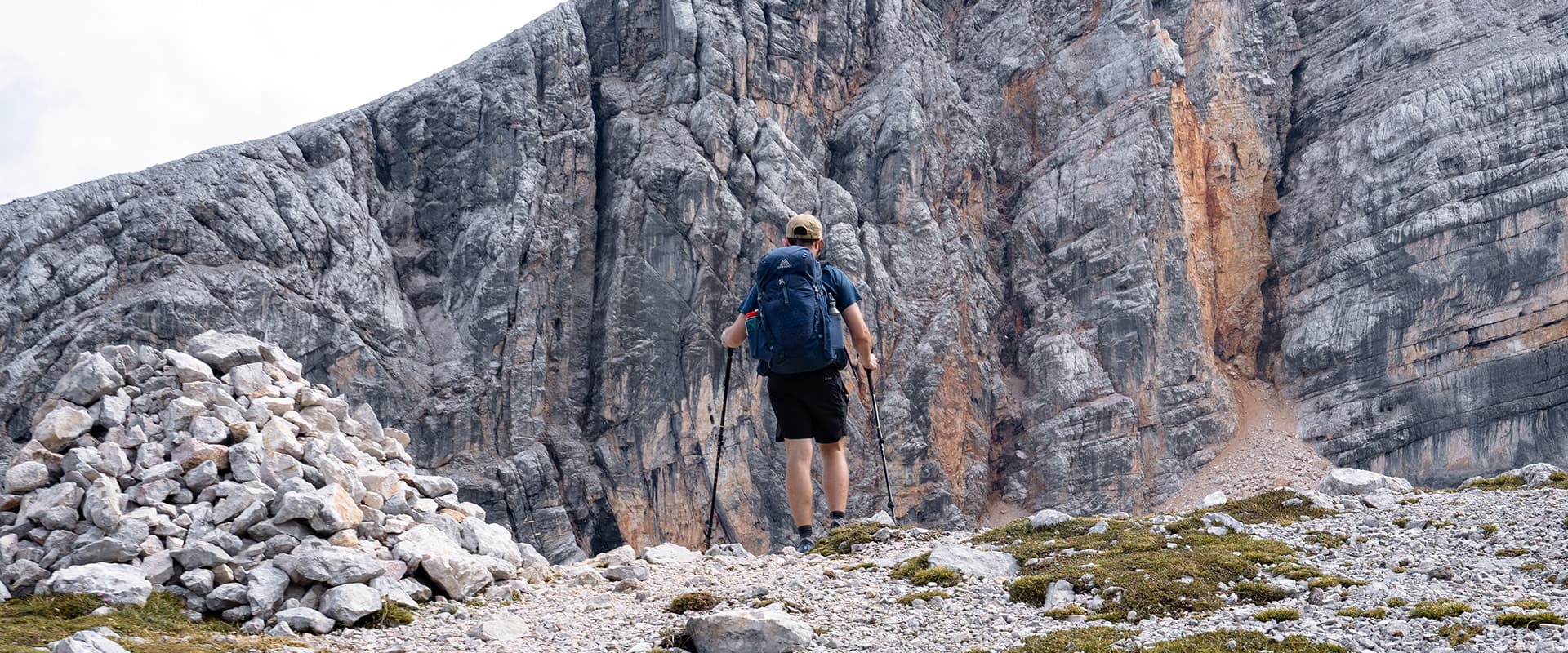 man hiking in dolomites mountains