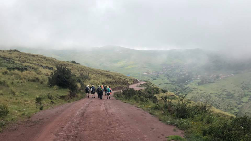 group of hikers on wide gravel road in Peru