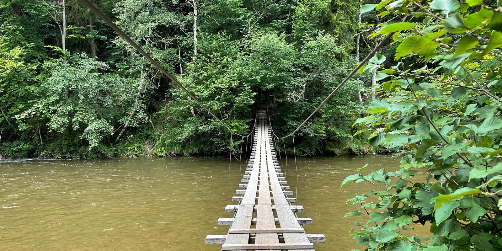 wooden suspension bridge over river