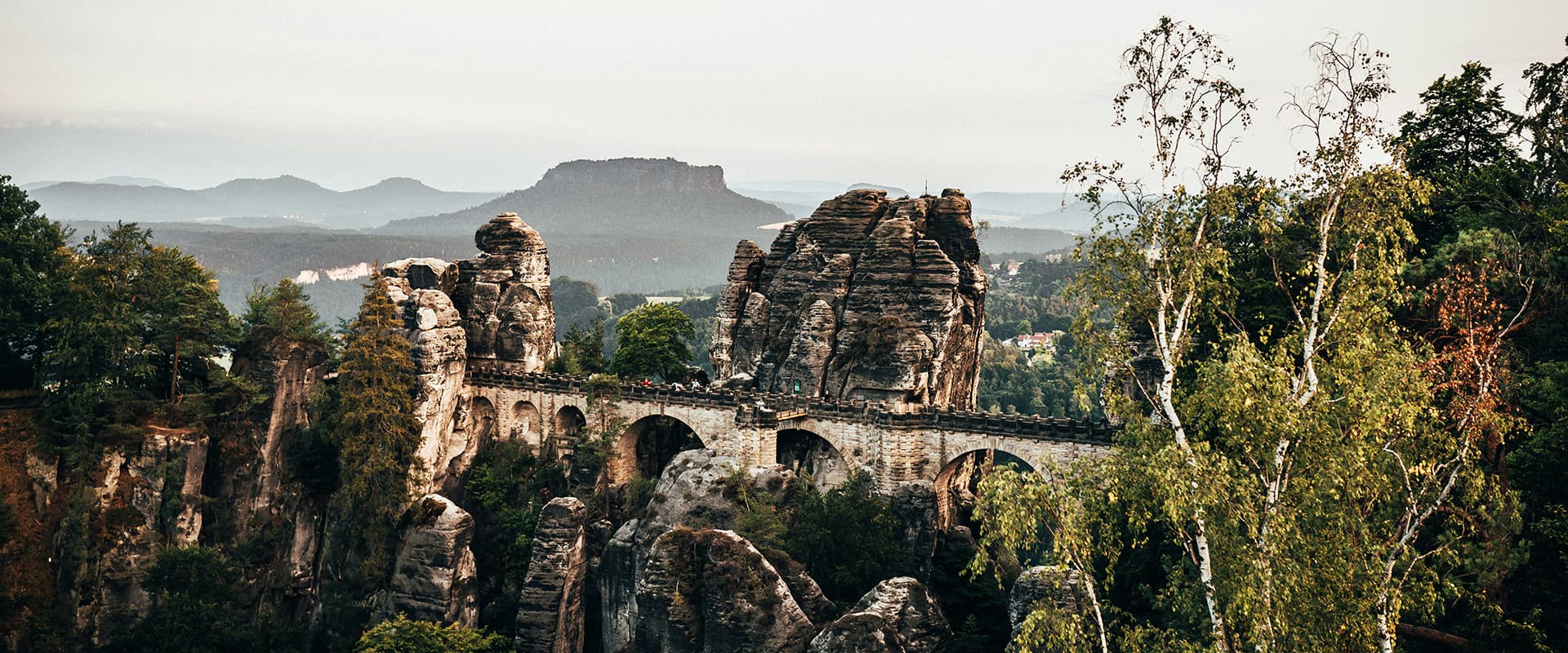 Bastei bridge in Lohmen with rock formations in background