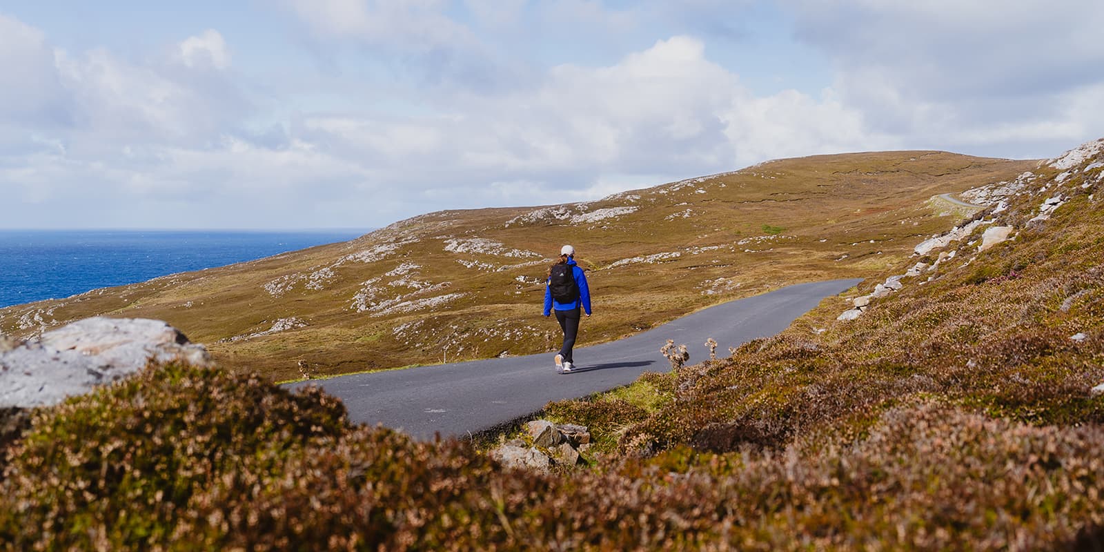 person hiking on Arranmore island, Ireland