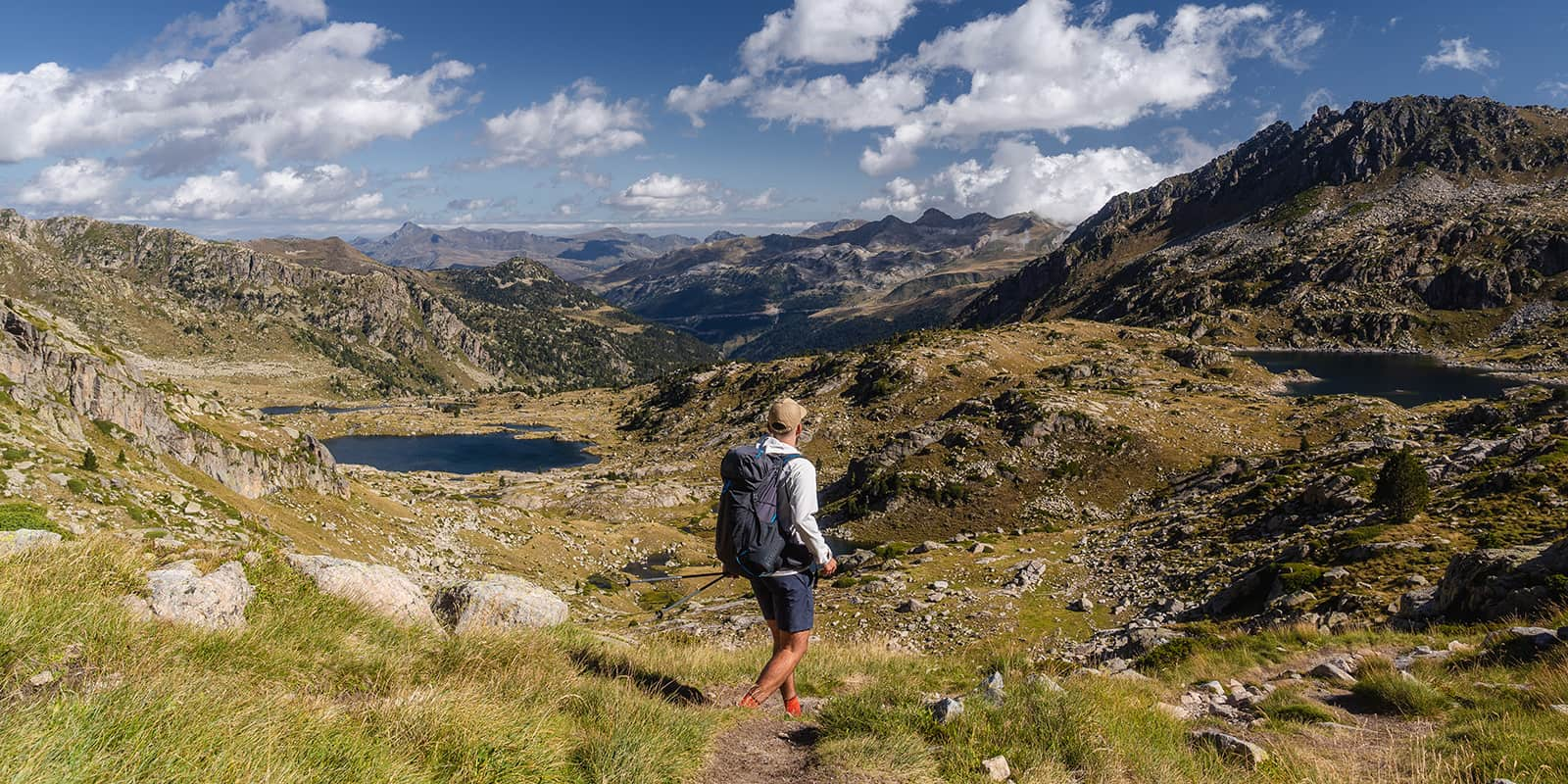 man hiking in the pyrenees mountains on the Carros de Foc