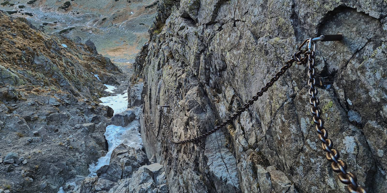 chains secured to mountain ridge