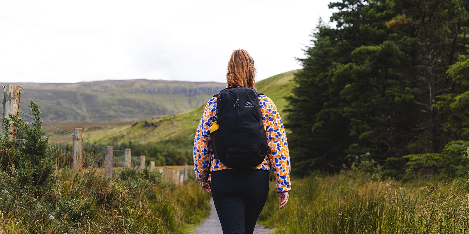 person hiking with Gregory backpack