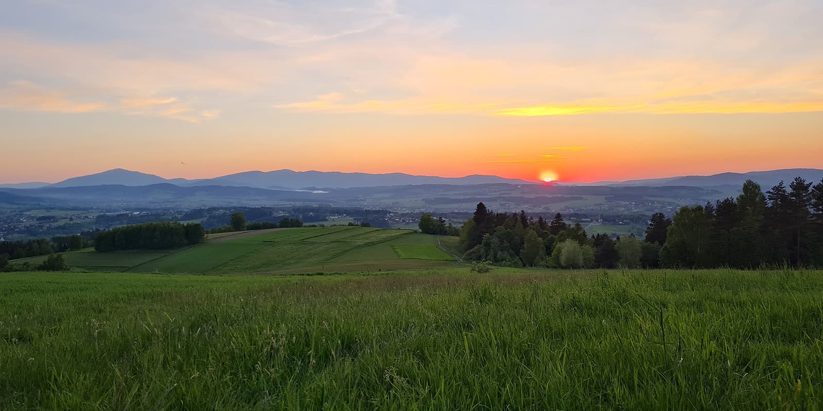 countryside in Poland with mountains in background