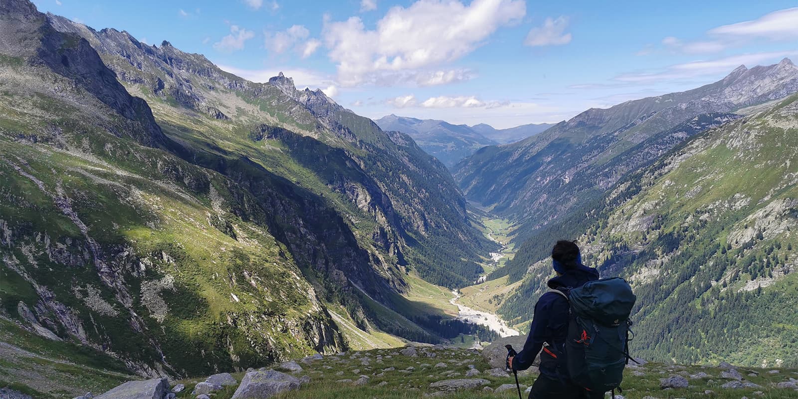 man looking out over mountain valley on the Berliner Höhenweg in Austria