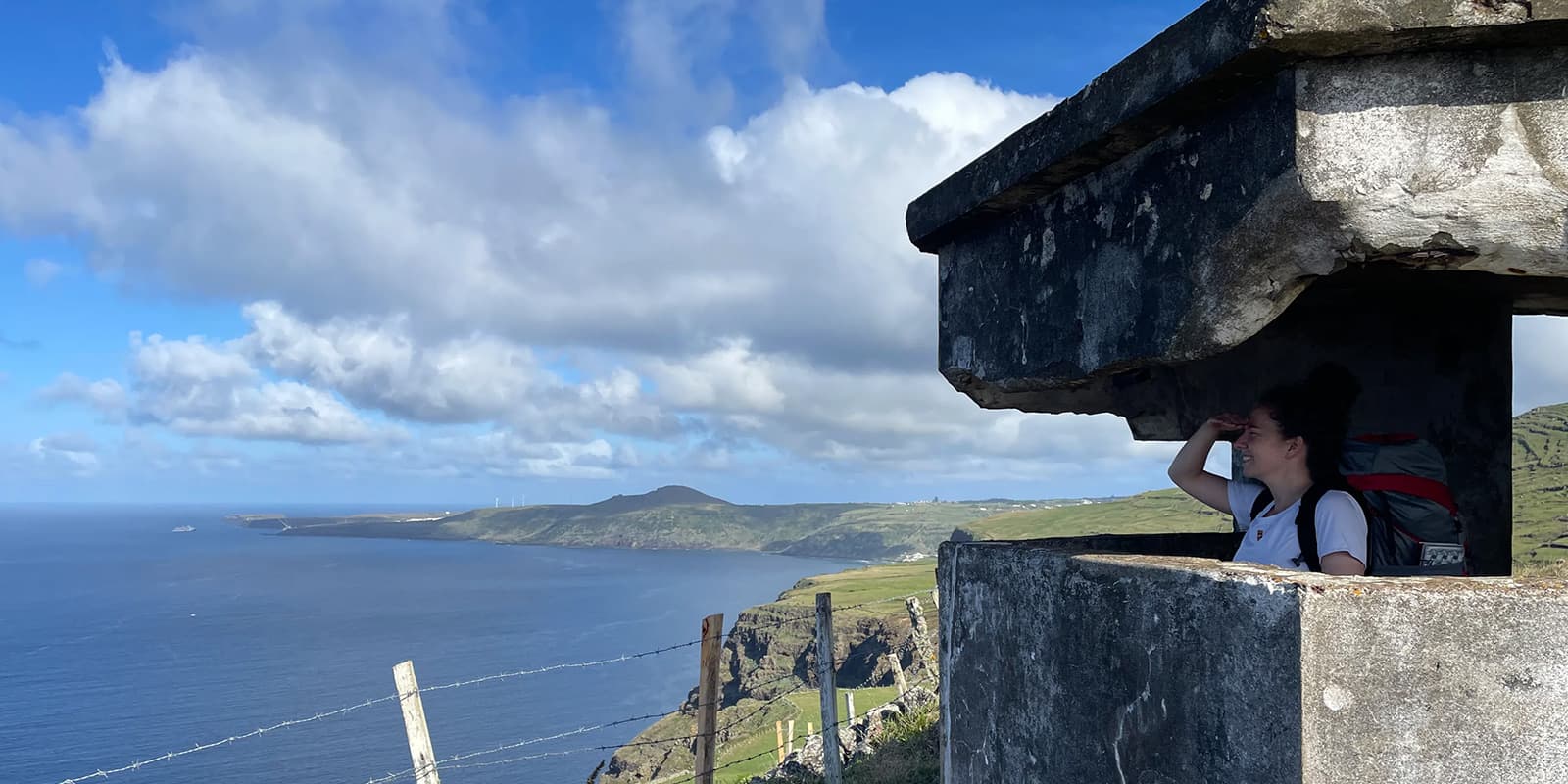 women overlooking the ocean