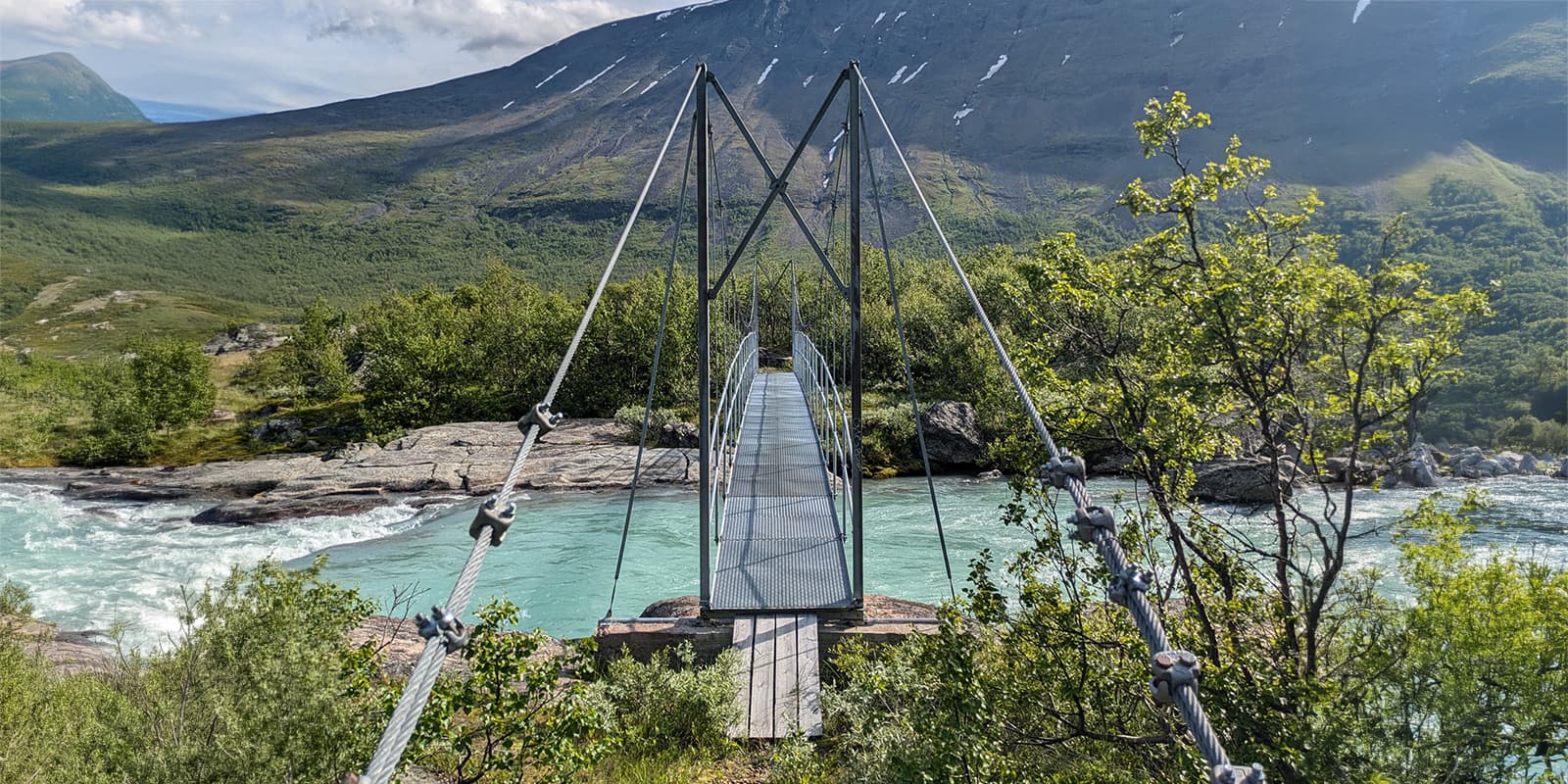 narrow walk bridge over river in Sweden