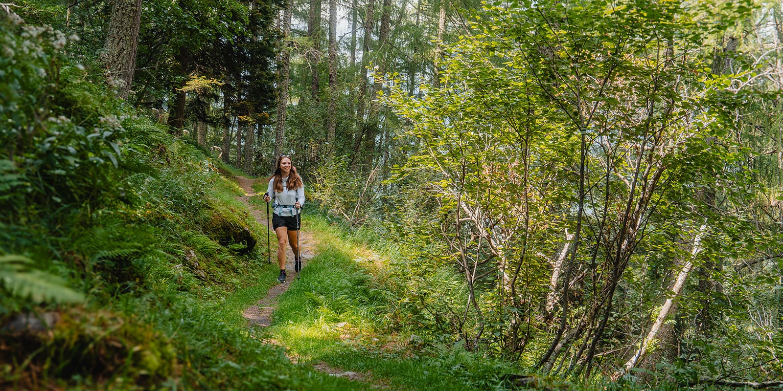 women hiking in forest in Switzerland