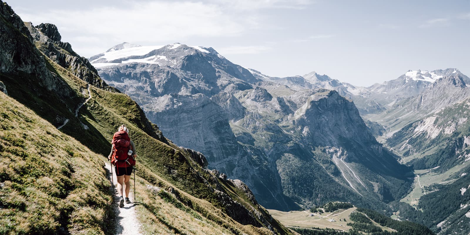 women hiking on small mountain path in Vanoise, France