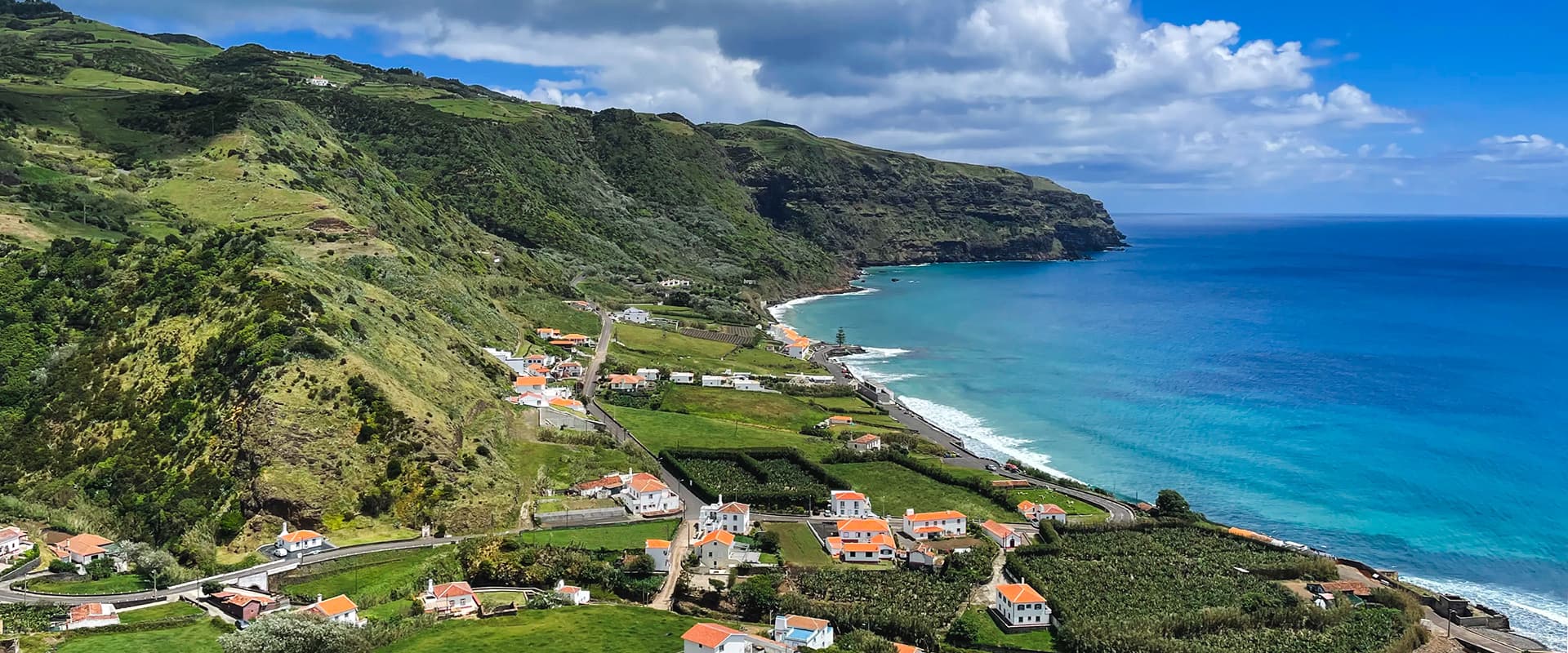 green coastline near blue ocean on the grand route santa maria