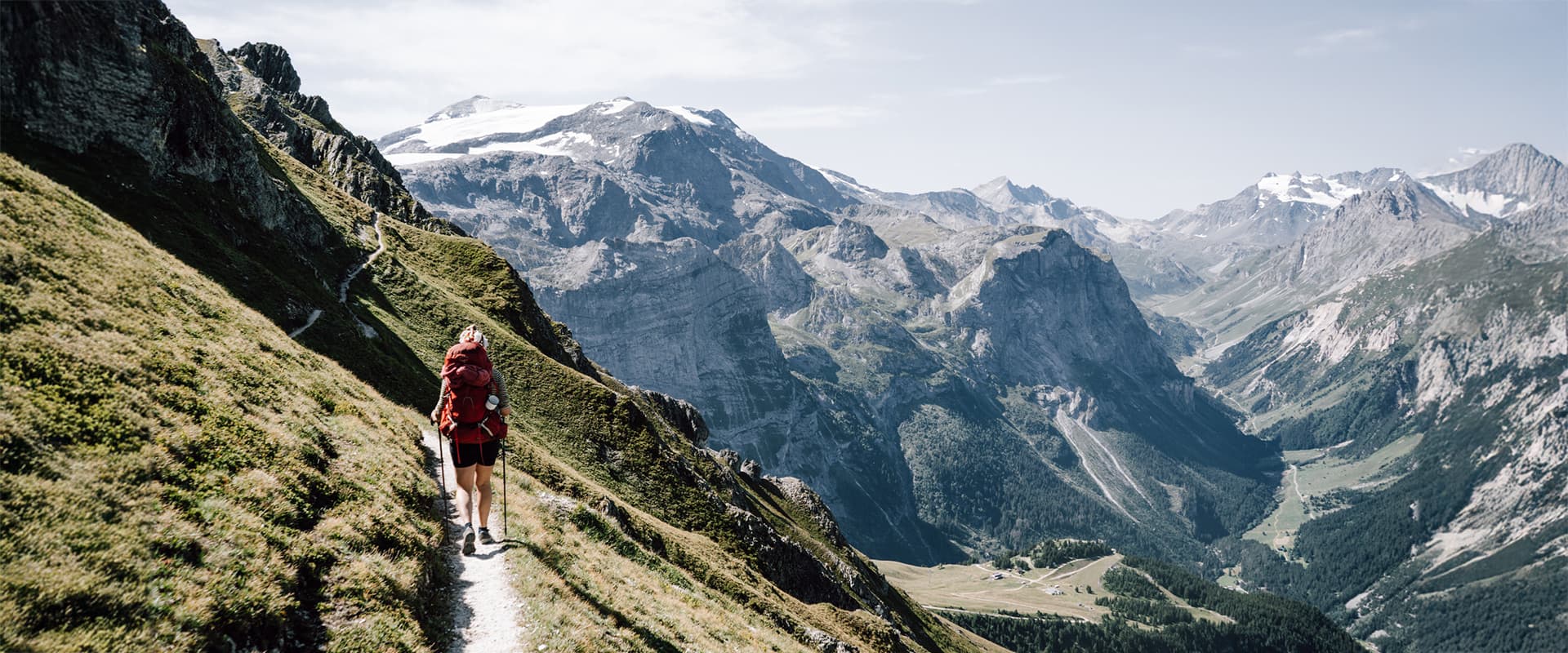 women hiking on small mountain path in Vanoise, France