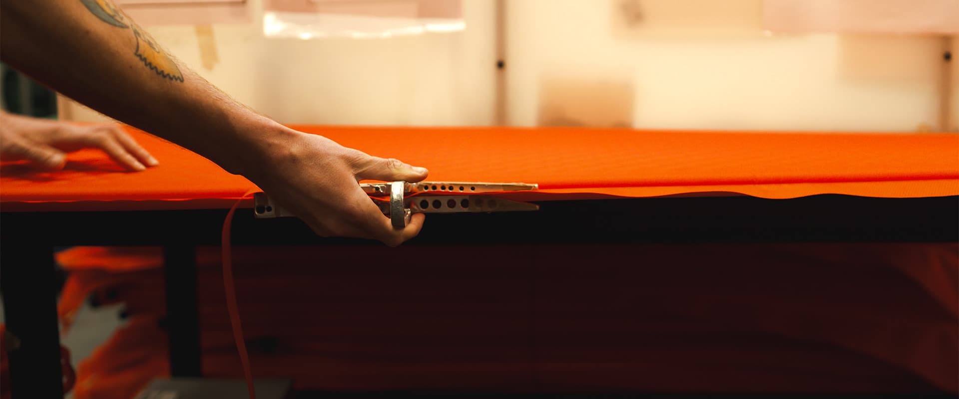 women trimming sleeping pad on the MSR and Therma-Rest Factory floor