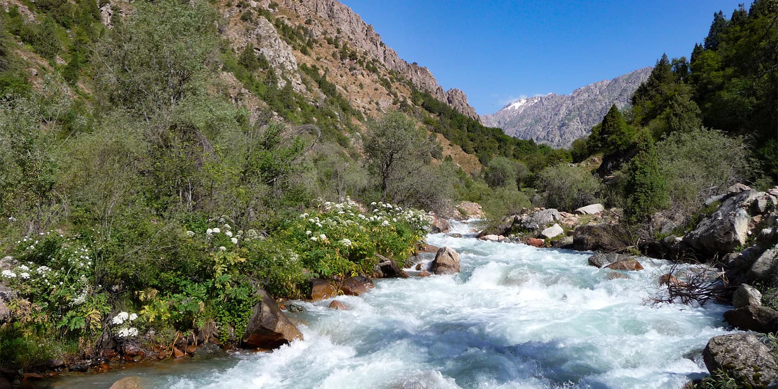 strong river running through mountain valley