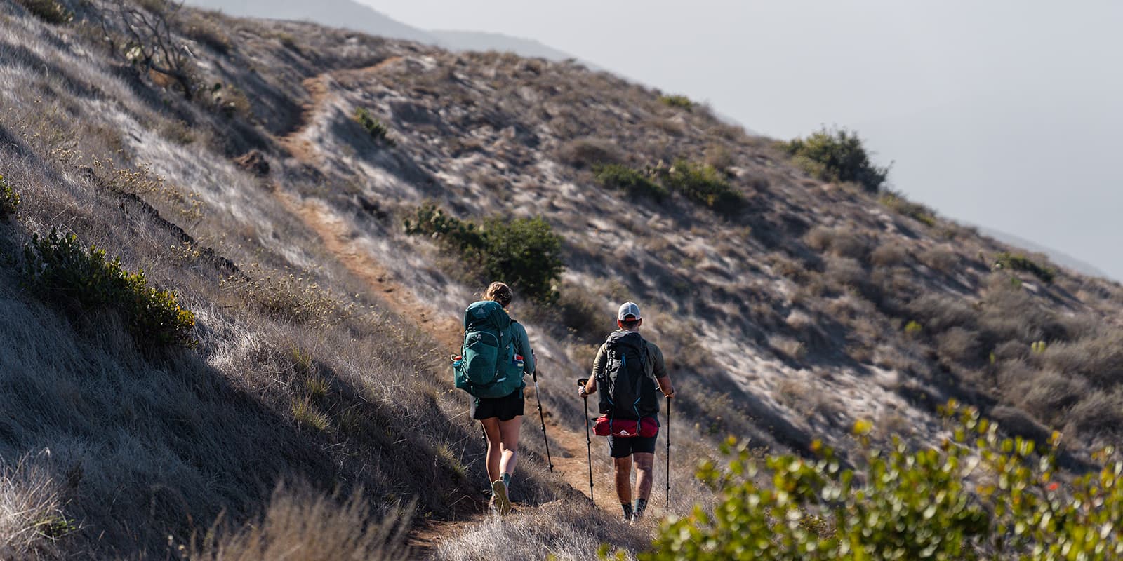 two persons hiking on the Trans-Catalina trail in California