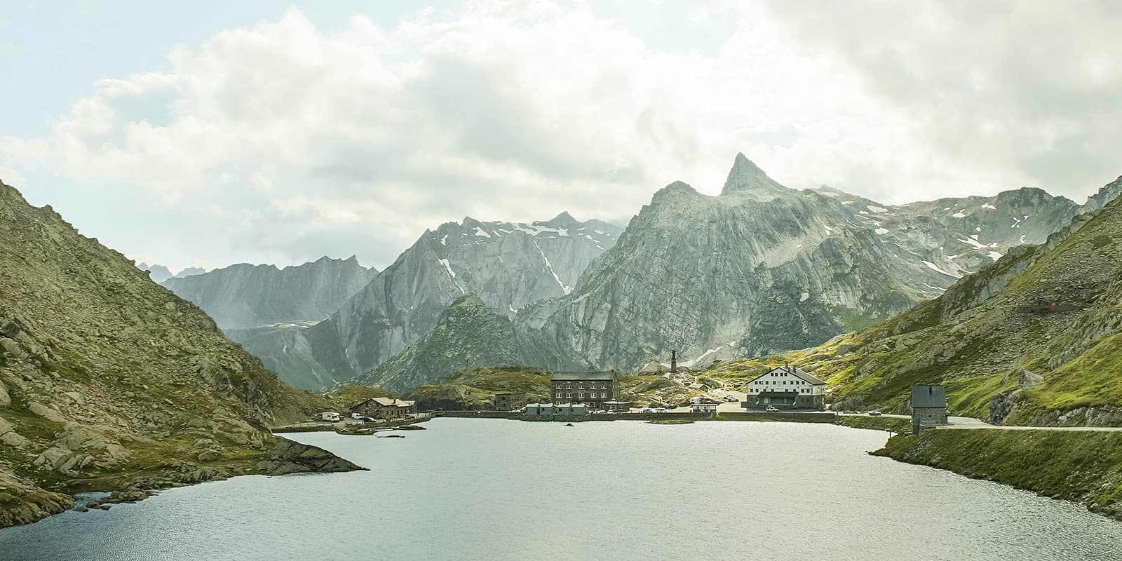 mountain lake with some buildings at bourg saint pierre in Switzerland