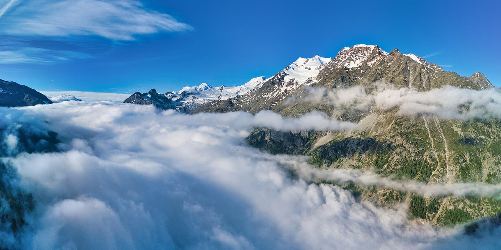 view of mountain covered in clouds