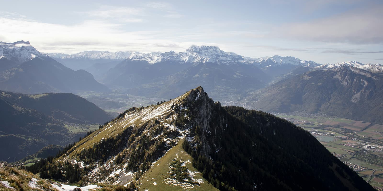 Tour du Muverans in Vaud, Swiss. green and white mountains and town in the valley