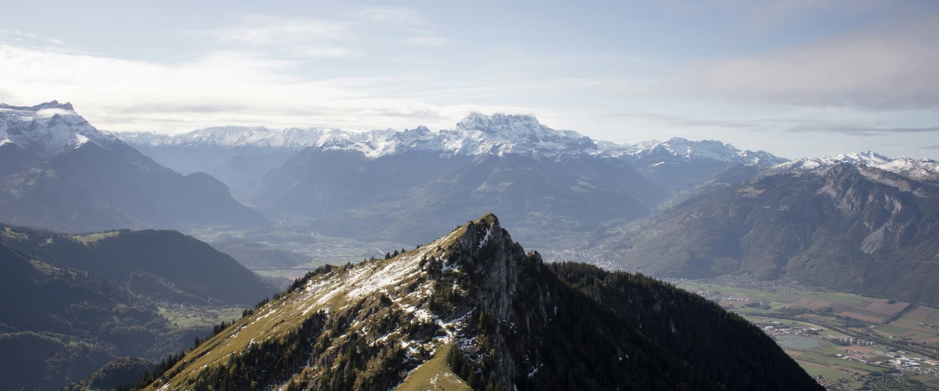 Tour du Muverans in Vaud, Swiss. green and white mountains and town in the valley