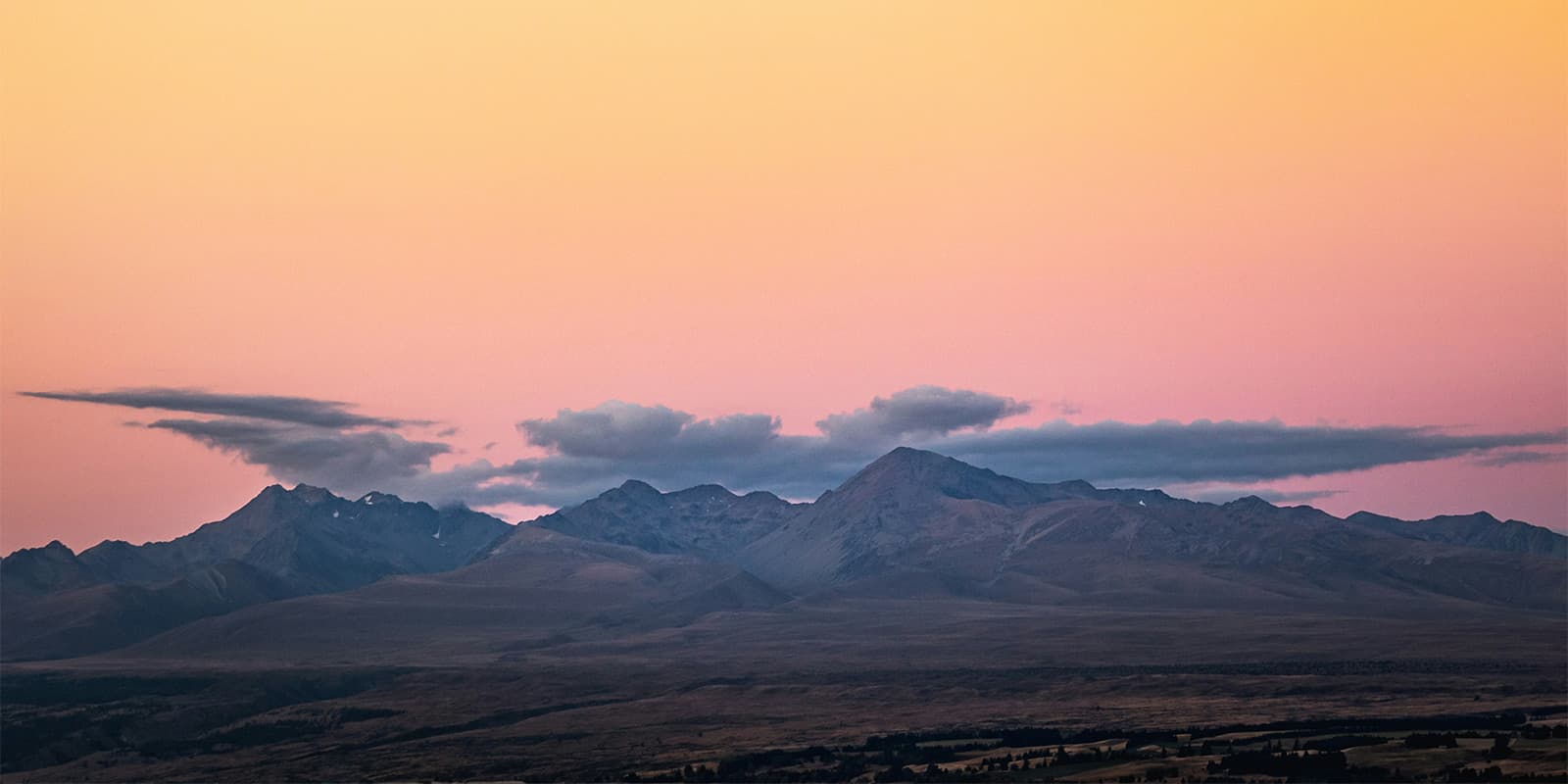 clouds forming over mountains in New Zealand at sunset on the Te Araroa
