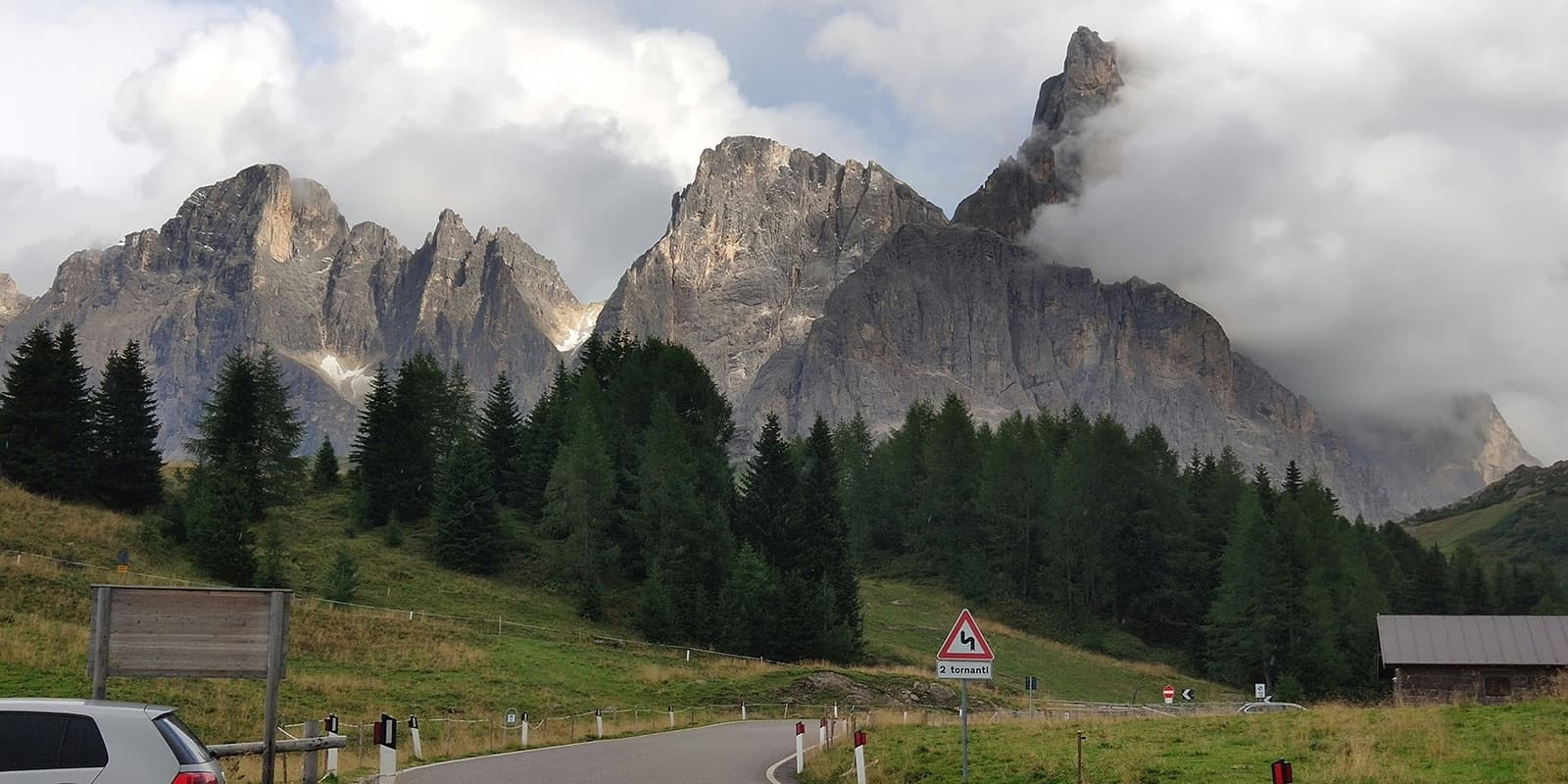 road in front of a mountain in the dolomites