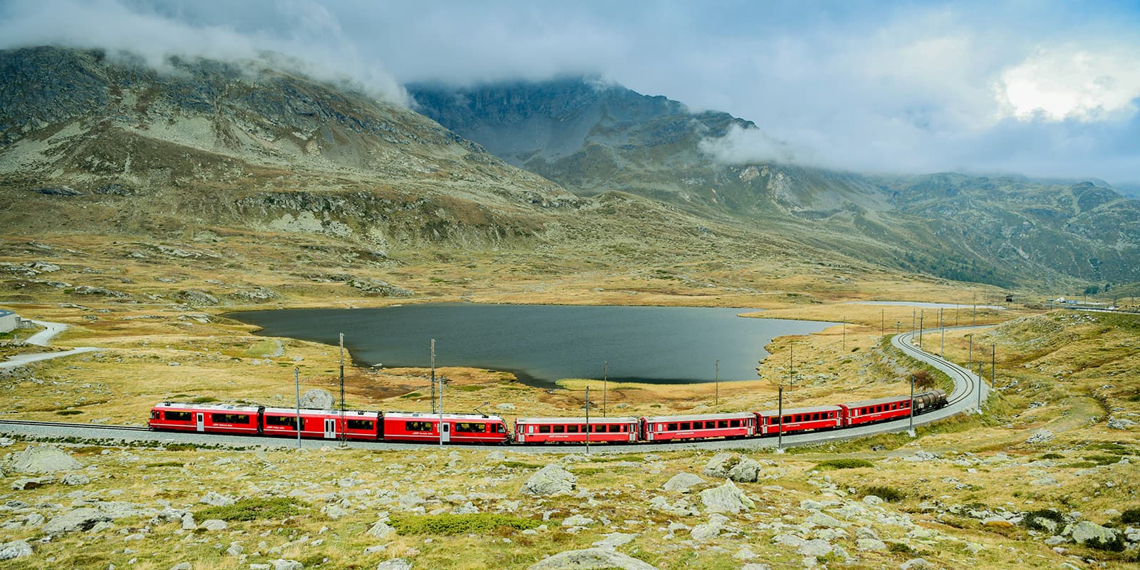 bernina express train in mountain valley