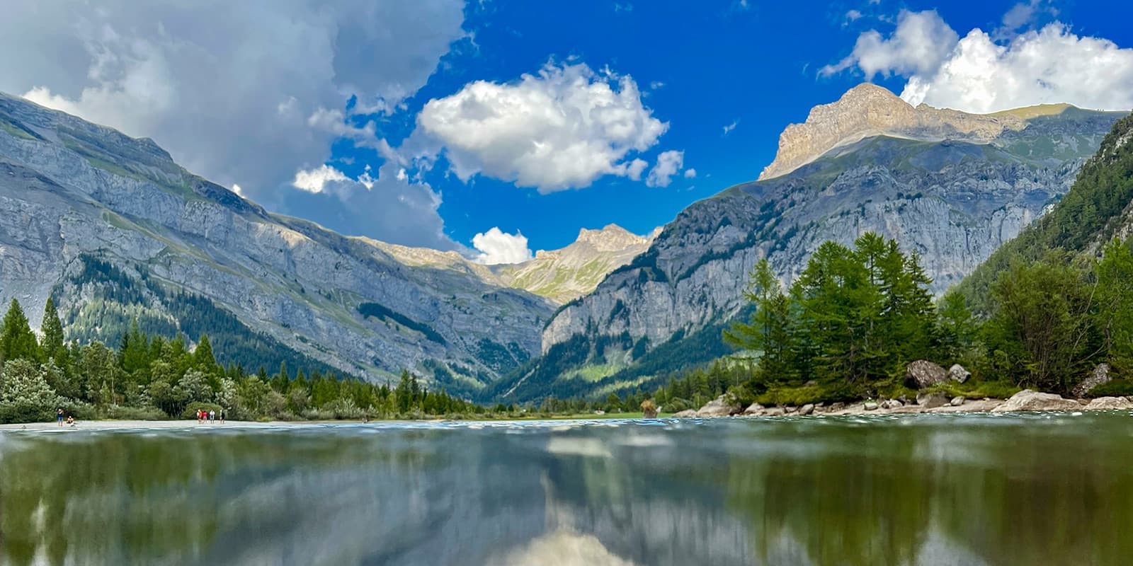 lake Derborence, mountain lake surrounded by trees