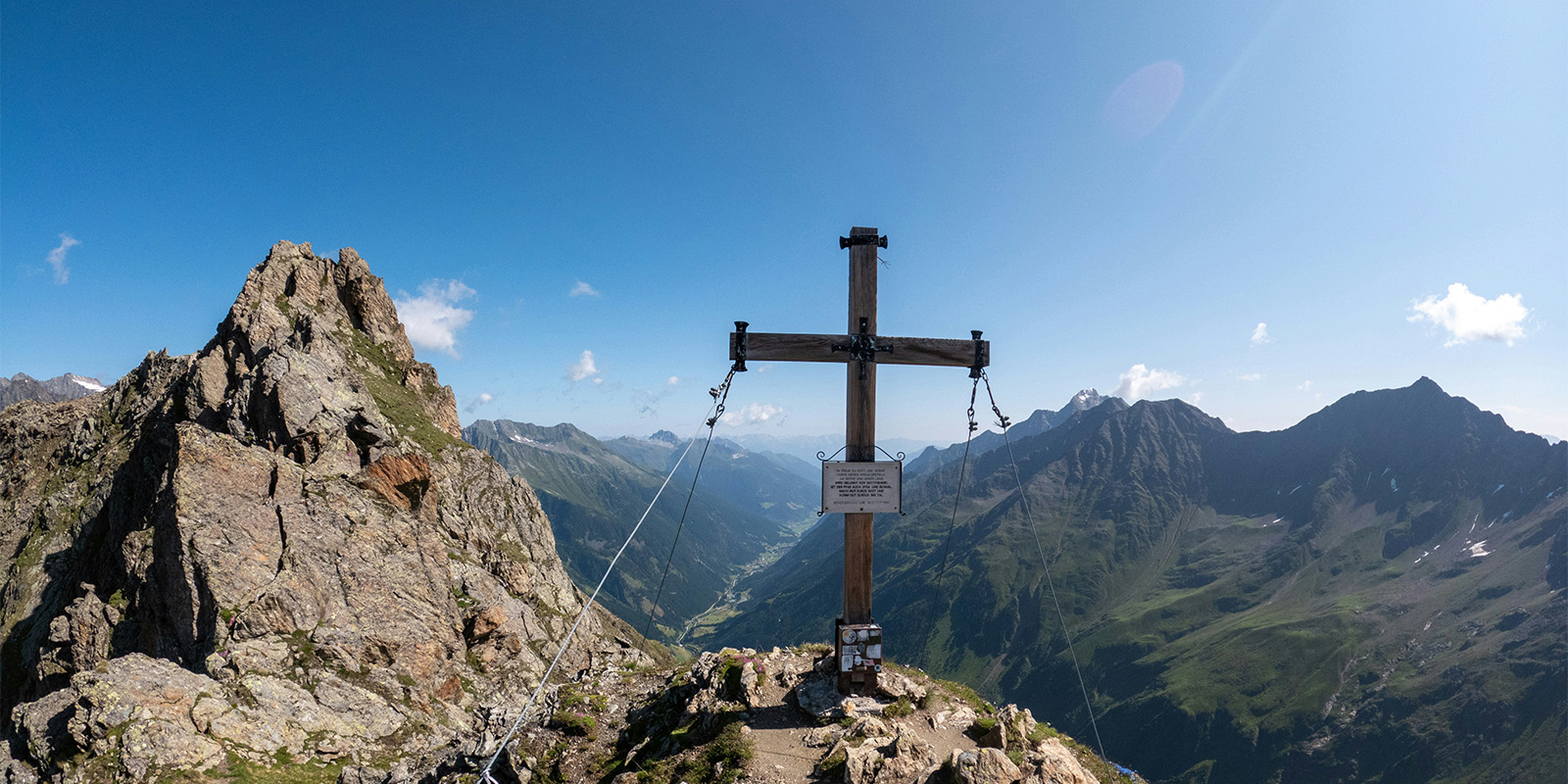 wooden cross on top of mountain in Austria