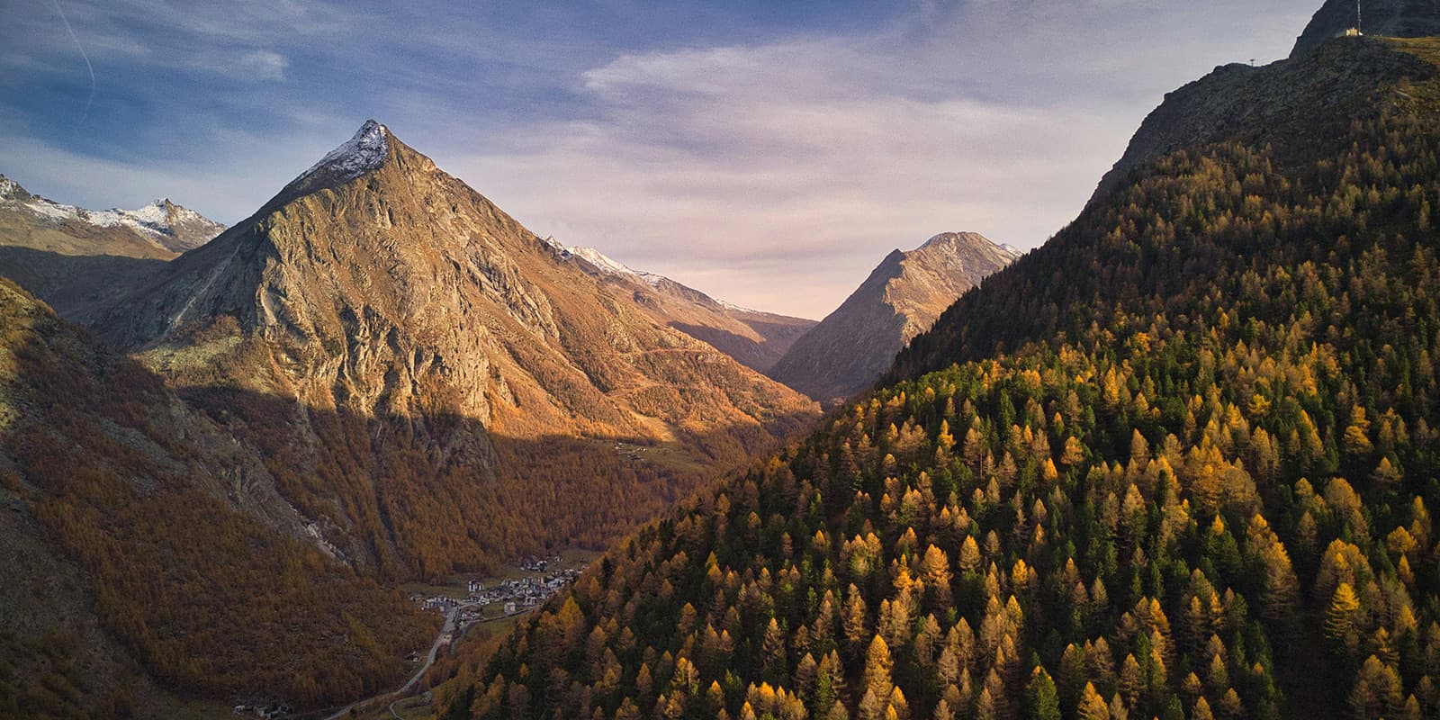 a road through the saas fe valley in the swiss mountains