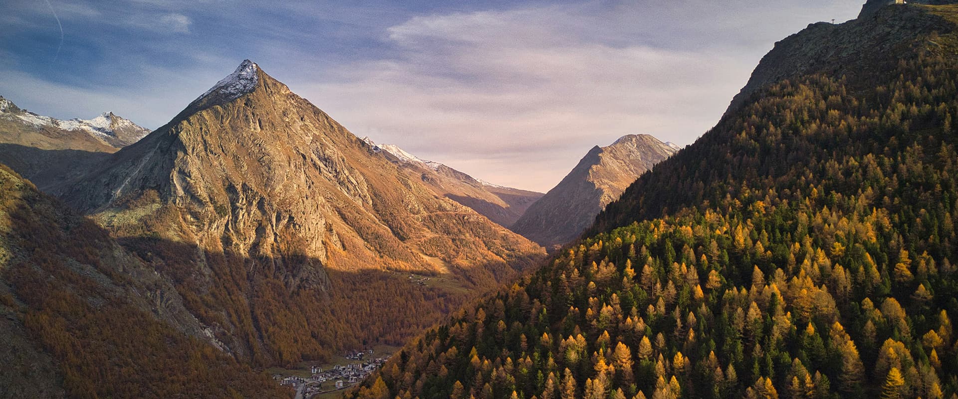 a road through the saas fe valley in the swiss mountains