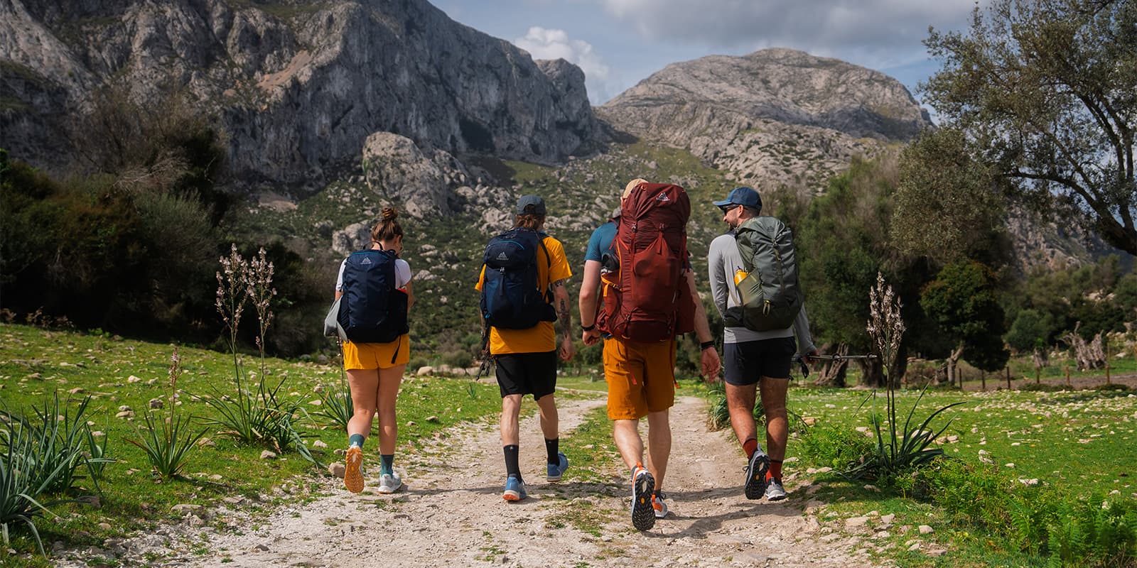 four hikers wearing Gregory packs in Mallorca