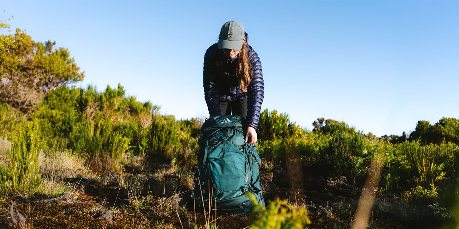 women setting down her Gregory backpack