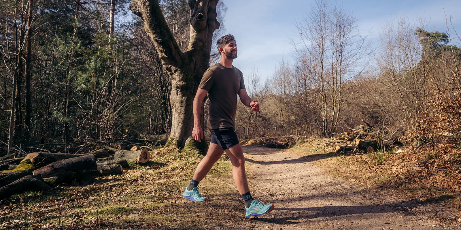 person hiking in forest on Topo shoes