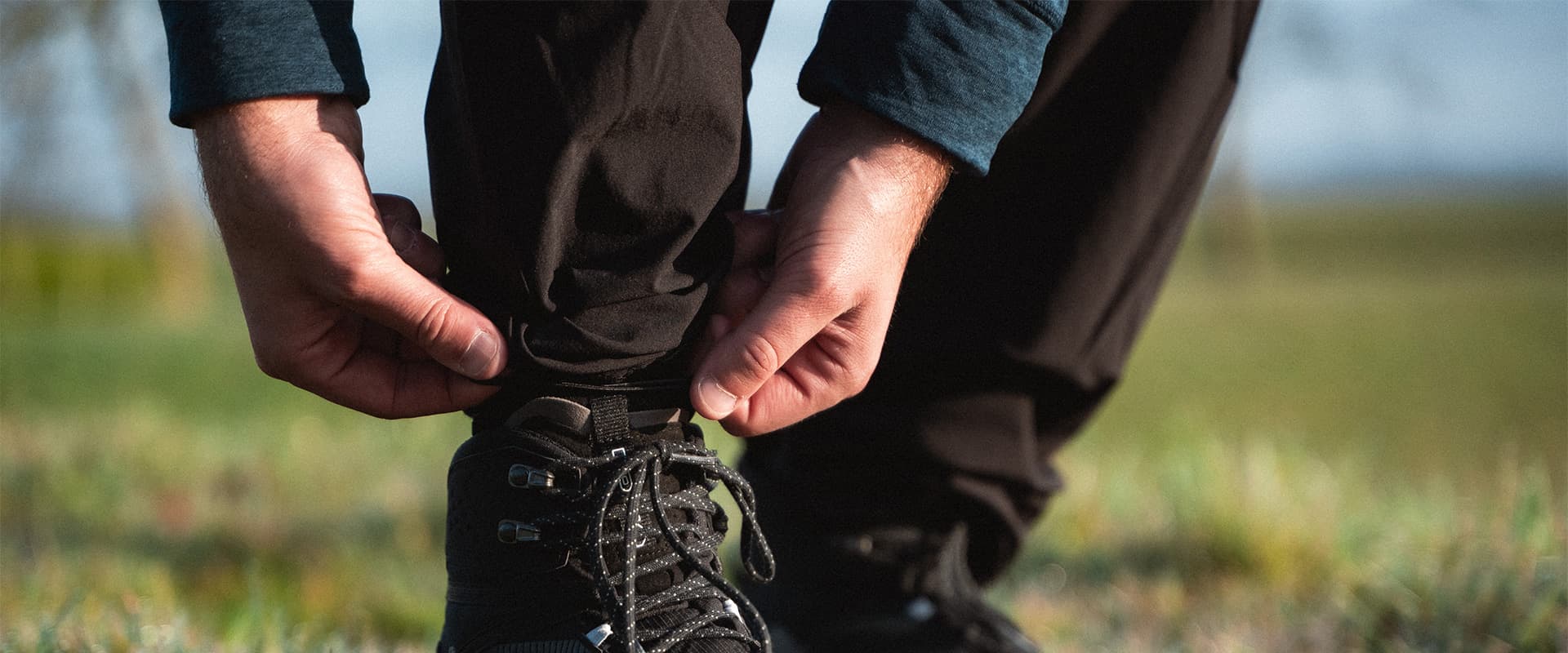 person adjusting his Maier Sports Nil outdoor pants